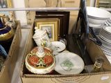 a box full of plates and vases sitting on a table