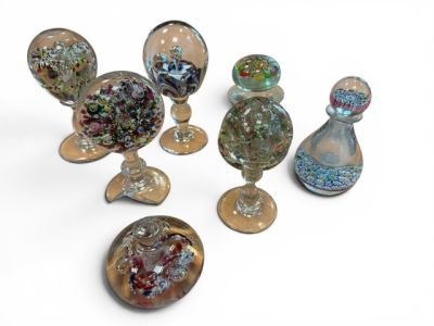 a lot of glass objects that are sitting on a table