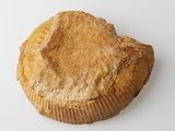 a muffin that is sitting on a white surface