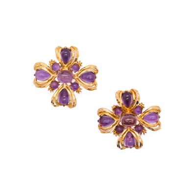 a pair of amethorate and gold earrings