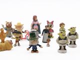 many figurines of different characters on a white surface