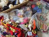 a basket full of yarn and other items on a table