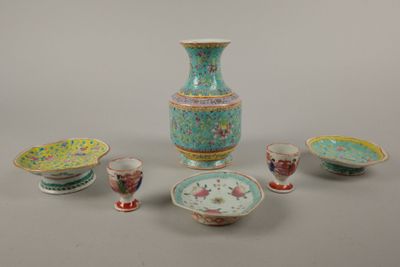 many different types of vases and bowls on the table