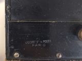 someone is holding a black box that has a label on it