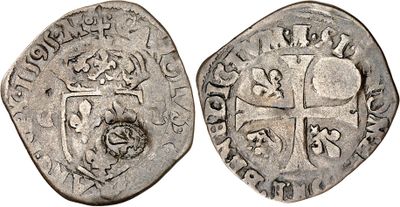 a silver coin with a shield on the front and a shield on the back