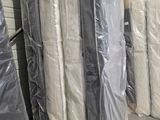 a lot of mattresses that are in the warehouse