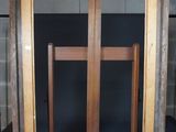 a picture of an easel with a cross on it