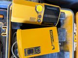 two yellow tools in a case on a table