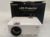 an image of a white projector sitting on top of a white table