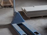 a fork lift in the middle of a warehouse floor