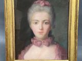 portrait of a woman in a pink dress in a gold frame