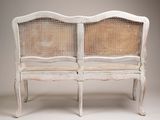 an image of a white bench with wicker backrests on a white background