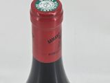a bottle of wine that is sitting on a table