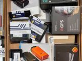a box full of electronic items that are on the floor