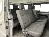 a seat in the back of a van that has two rows of seats