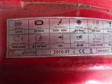 a close up of a red motorcycle with a sticker on it ' s side