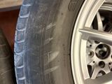 tire treads and rims on a car in a garage