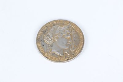 a close up of a coin on a white surface with a white background
