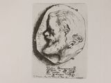 a black and white drawing of a man ' s face on a piece of paper
