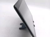 a close up of a cell phone on a stand