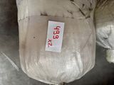 a bag with a label on it sitting on a chair
