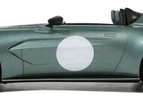 a green sports car with a white circle on the side of it