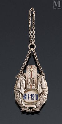 an image of a silver necklace with a cross and a wreath
