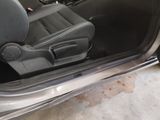a car door open with the driver ' s seat down