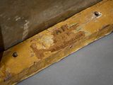 a piece of wood with a sign on it