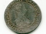 une vieille pièce d'argent sur laquelle figure l'effigie d'un homme