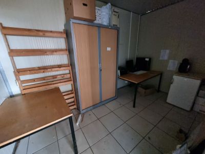 a room with a desk and a chair in it