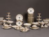 many different types of plates and bowls on the table