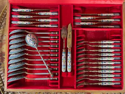 silverware in a red box with spoons and spoons in it
