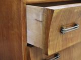 a close up of a wooden cabinet with a drawer