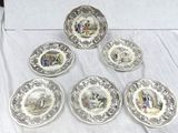 six plates with different designs on them sitting on a table