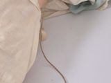 a person laying on a bed with a blanket on it
