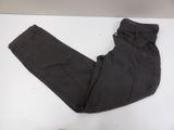 black pants on a white table next to a pair of shoes