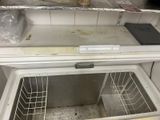 an empty freezer in a kitchen with a lot of food inside of it