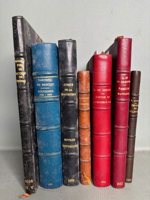 books are lined up in a row on a table