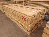 a lot of lumber stacked on top of each other