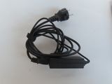 a black power cord that is plugged into the wall