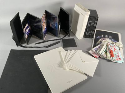the contents of a photo album are laid out on the table
