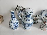 many different types of vases and bowls on the table