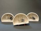 three lamps that are sitting on top of each other