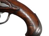 a close up of a gun on a white background