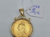 a gold coin with a picture of a woman on it