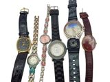 a lot of watches that are sitting together on a table