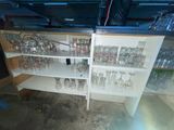 many empty glasses on the shelves in the room