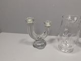 three glass vases sitting on a table next to each other