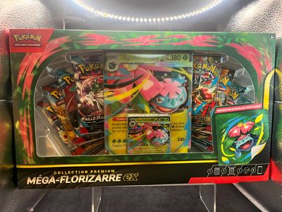 the box contains a collection of pokemon cards, including a mega - florizarre